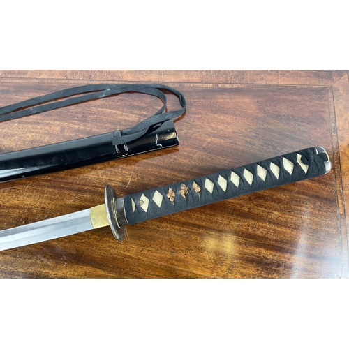 11 - SAMURAI SWORD 'KATANA', with shagreen style grip and black lacquer sheath, 105cm L.