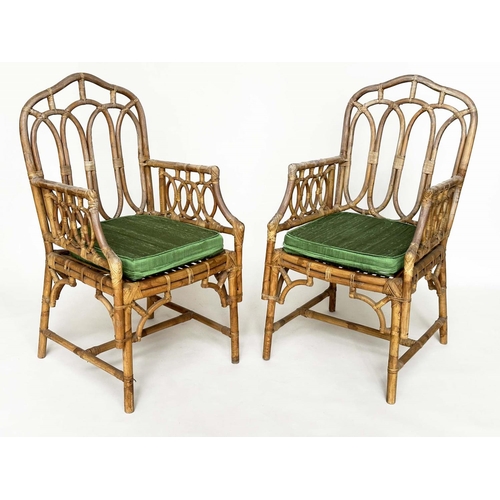 121 - CONSERVATORY ARMCHAIRS, a pair, vintage bamboo, rattan framed and cane bound with Gothic arched back... 