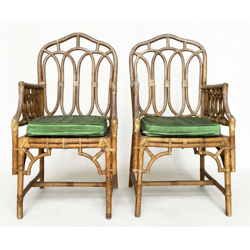 121 - CONSERVATORY ARMCHAIRS, a pair, vintage bamboo, rattan framed and cane bound with Gothic arched back... 