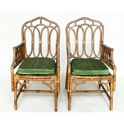 121 - CONSERVATORY ARMCHAIRS, a pair, vintage bamboo, rattan framed and cane bound with Gothic arched back... 