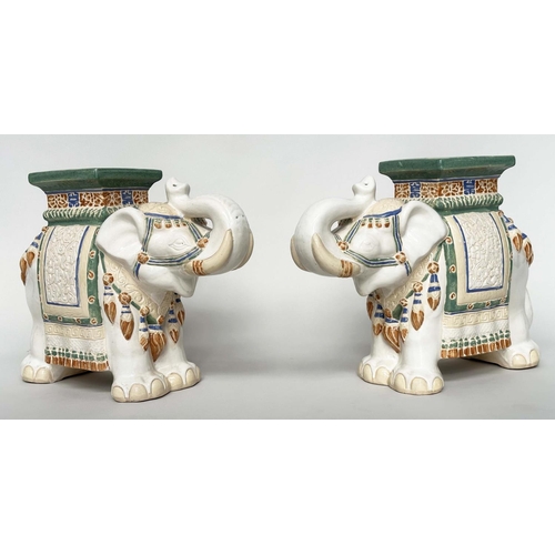 122 - ELEPHANT STOOLS, a pair, Indian ceramic polychrome of elephants in ceremonial regalia with seats. (2... 