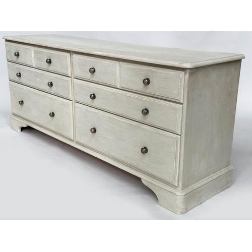 123 - LOW CHEST, George III design traditionally grey painted with an arrangement of eight drawers and bra... 