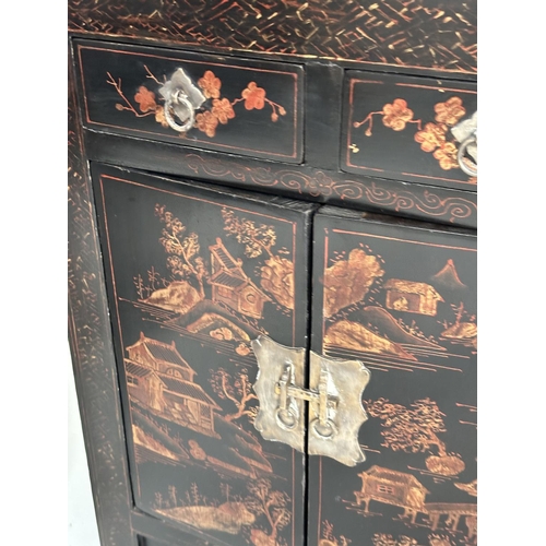 130 - CHINESE CABINETS, a pair, early 20th century lacquered, silvered metal mounted and gilt chinoiserie ... 