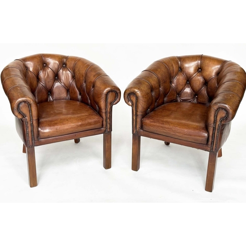 141 - LIBRARY ARMCHAIRS, a pair, club style buttoned soft mid brown leather with curved back and scroll ar... 