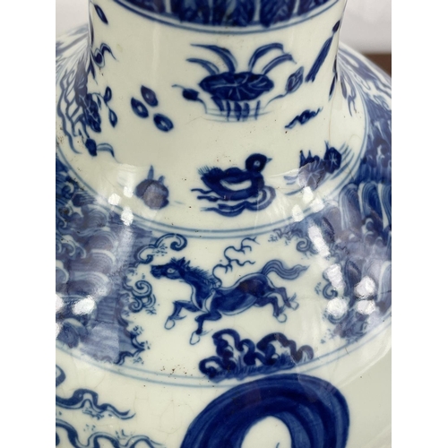 15 - CHINESE BOTTLE VASE, blue and white with figural decoration, 31cm H.