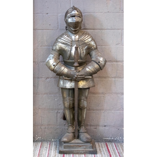 150 - FIRE SIDE COMPANION SET, 66cm H x 28cm W, cast iron in the form of a knight in armour, comprising a ... 