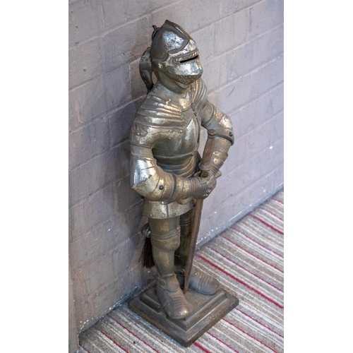 150 - FIRE SIDE COMPANION SET, 66cm H x 28cm W, cast iron in the form of a knight in armour, comprising a ... 