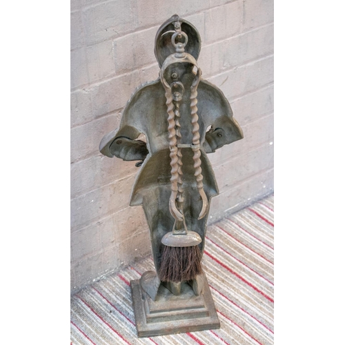 150 - FIRE SIDE COMPANION SET, 66cm H x 28cm W, cast iron in the form of a knight in armour, comprising a ... 