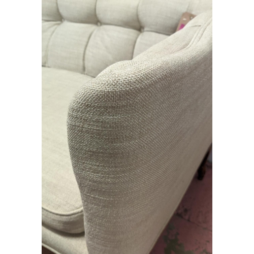 154 - SOFA,200cm W x 75cm D x 80cm H, buttoned with a wavy back, Continental style with carved supports.