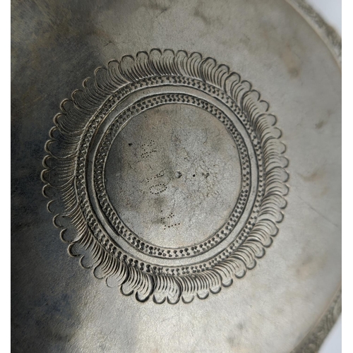 19 - A COLLECTION OF BURMESE/EASTERN SILVER PLATED ITEMS, comprising four heavily embossed bowls and a ju... 