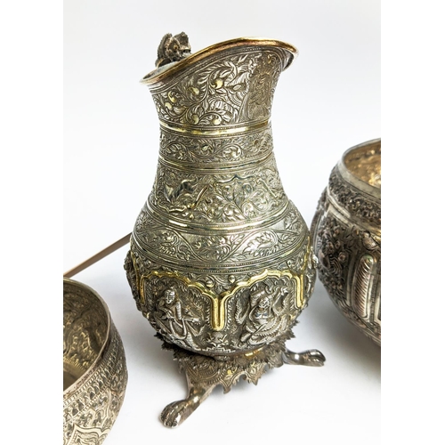 19 - A COLLECTION OF BURMESE/EASTERN SILVER PLATED ITEMS, comprising four heavily embossed bowls and a ju... 