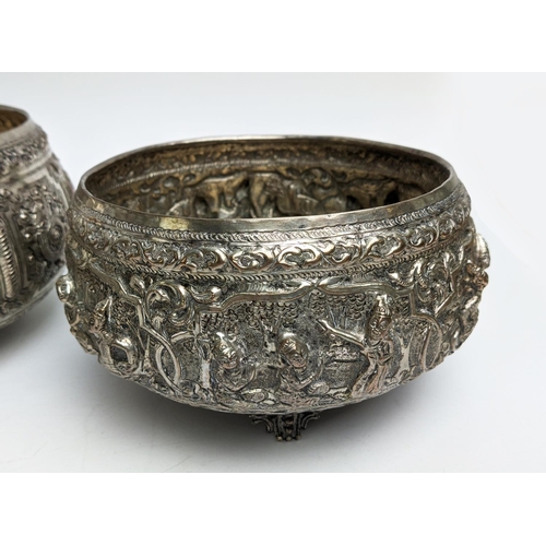 19 - A COLLECTION OF BURMESE/EASTERN SILVER PLATED ITEMS, comprising four heavily embossed bowls and a ju... 