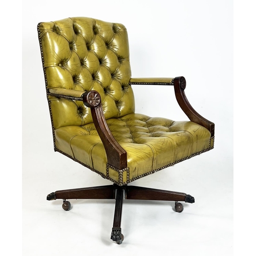 208 - CAPTAINS DESK CHAIR, buttoned green leather on swivel base with brass paw feet and castors, 97cm  H ... 