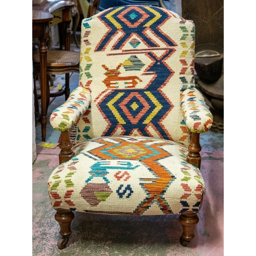 246 - ARMCHAIR, 88cm H x 67cm W, Victorian walnut in kilim upholstery on ceramic castors, back leg stamped... 