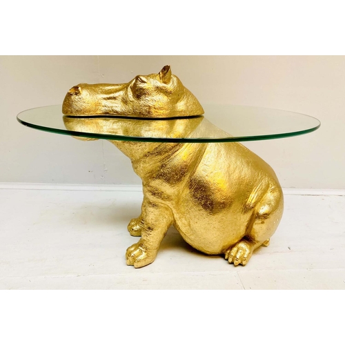 397 - HIPPOPOTAMUS LOW TABLE, gilt resin, glass top, 60cm x 45cm x 50cm.