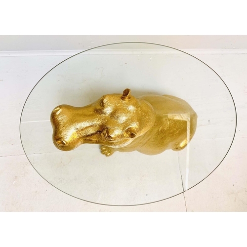 397 - HIPPOPOTAMUS LOW TABLE, gilt resin, glass top, 60cm x 45cm x 50cm.