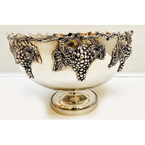 409 - CHAMPAGNE COOLER, 25cm H x 37cm diam., with grape vine detail, polished metal.