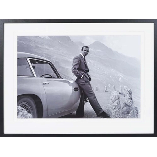 410 - SEAN CONNERY AS JAMES BOND WITH ASTON MARTIN, photographic print, framed, 63cm x 83cm.