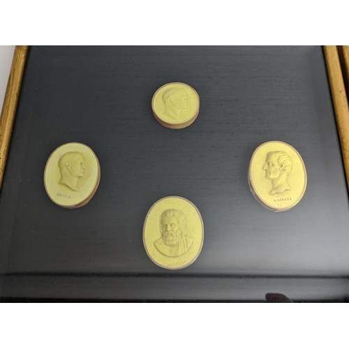 420 - A COLLECTION OF PLASTER INTAGLIO PORTRAIT ROUNDELS, mounted and framed.