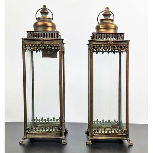 511 - STORM LANTERNS, a pair, gilt metal glazed, 54cm H. (2)