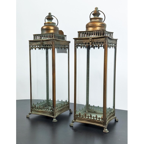 511 - STORM LANTERNS, a pair, gilt metal glazed, 54cm H. (2)