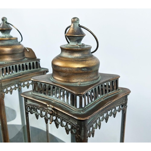 511 - STORM LANTERNS, a pair, gilt metal glazed, 54cm H. (2)