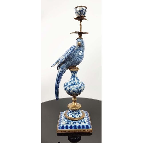 515 - CANDLESTICKS, a pair, in the form of parrots perched on pedestals, blue and white ceramic, gilt meta... 