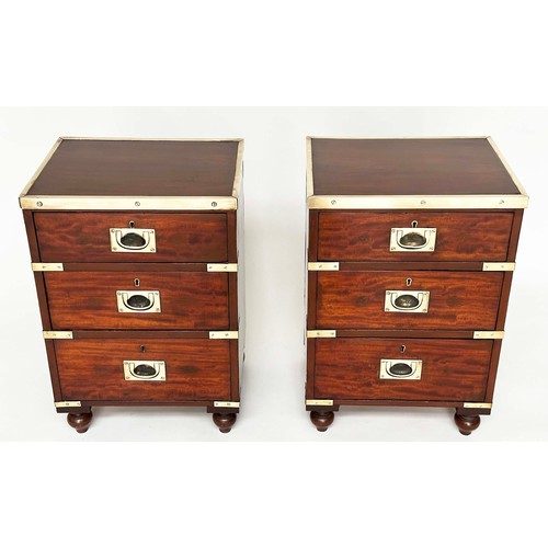 115 - CAMPAIGN CHESTS, a pair, mahogany and brass bound each with three drawers and turned supports, 44cm ... 