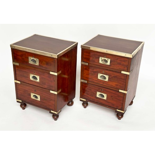 115 - CAMPAIGN CHESTS, a pair, mahogany and brass bound each with three drawers and turned supports, 44cm ... 