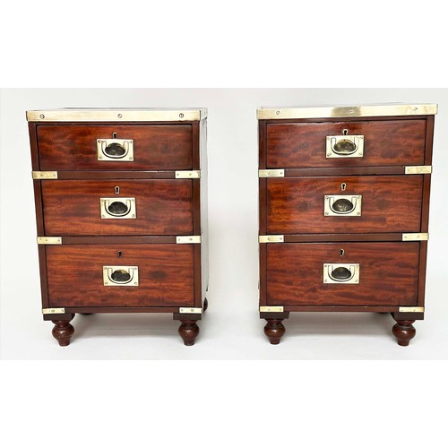 115 - CAMPAIGN CHESTS, a pair, mahogany and brass bound each with three drawers and turned supports, 44cm ... 