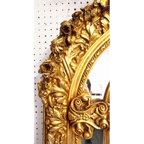 517 - WALL MIRROR, rococo style, giltwood frame, cherub finials and a shell and foliate surmount, classica... 