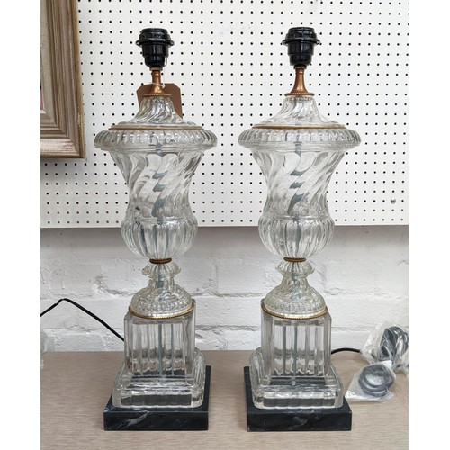 509 - TABLE LAMPS, 58cm H, a pair, in the classical style, glass, black marble bases.