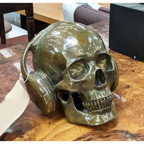 492 - CONTEMPORARY SCHOOL SCULPTURAL STUDY, DJ skull, bronzed metal, 17cm H.