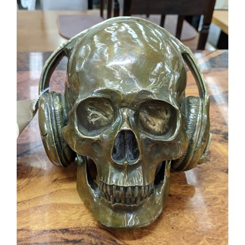 492 - CONTEMPORARY SCHOOL SCULPTURAL STUDY, DJ skull, bronzed metal, 17cm H.