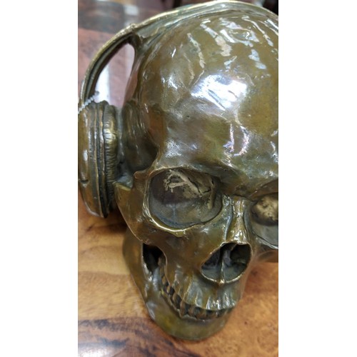 492 - CONTEMPORARY SCHOOL SCULPTURAL STUDY, DJ skull, bronzed metal, 17cm H.