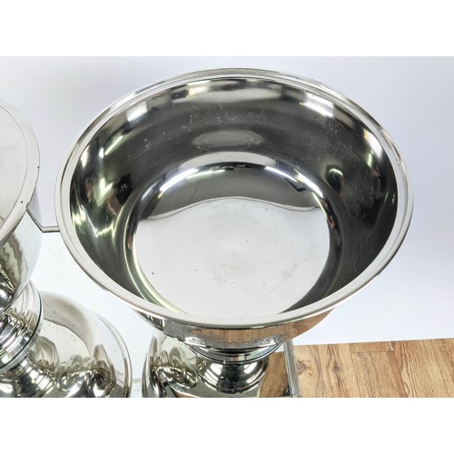 518 - CHAMPAGNE COOLERS, a pair, four sectioned, polished metal, 32cm H x 37cm diam. (2)