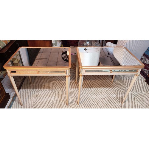 153 - END TABLES, a pair, each 85cm W x 79cm H x 65cm D, with antiqued mirrored tops and distressed painte... 