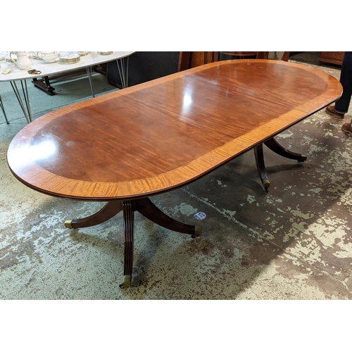 382 - DINING TABLE, Regency style mahogany with crossbanded detail, with two extra leaves on twin quadrafo... 