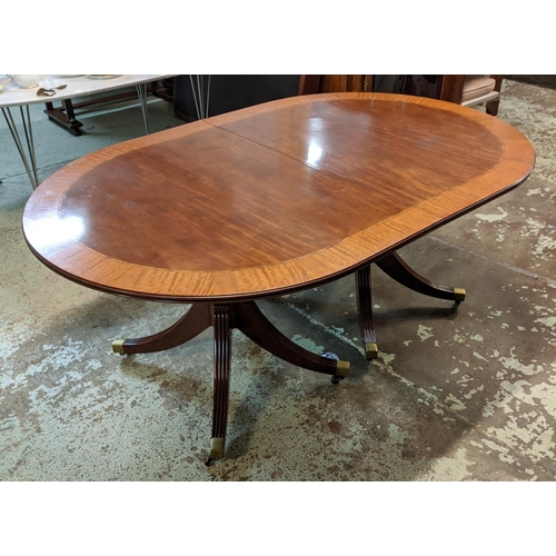 382 - DINING TABLE, Regency style mahogany with crossbanded detail, with two extra leaves on twin quadrafo... 