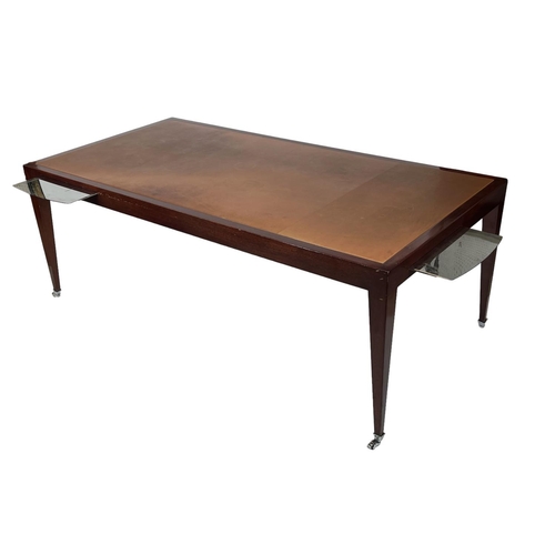 182 - WRITING TABLE, in the manner of David Linley, tan leather with steel brushing slides and castors, 19... 