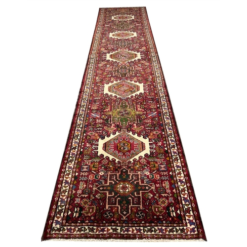 102 - PERSIAN KARAJA LONG RUNNER, 337cm x 85cm.