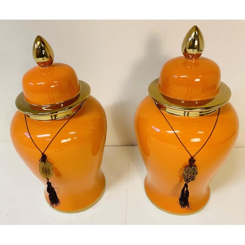 343 - TEMPLE JARS, a pair, 60cm high, 34cm diameter, glazed ceramic, orange body and gold rims. (2)