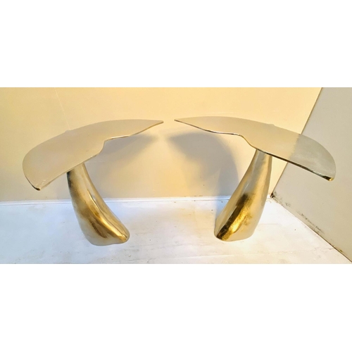 353 - SIDE TABLES, 55cm high, 54cm wide, 44cm deep, pair, in the form of Whale tails, polished metal. (2)