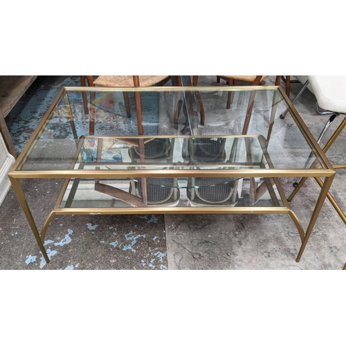 368 - LOW TABLE, 110cm W x  70cm D x 52cm H, with a glass top and undertier.