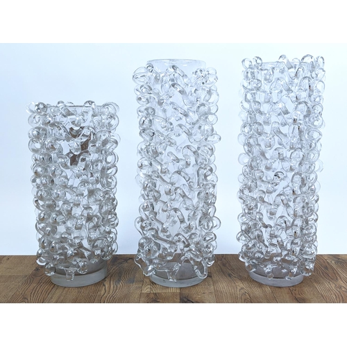 390 - TAMANIN GLASS VASES, a set of two similar and one other smaller, 60cm H at tallest. (3)