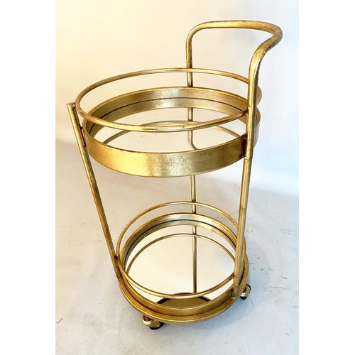 398 - COCKTAIL TROLLEY, 77cm high, 42cm diameter, 1960s French style, mirrored glass tiers, gilt metal fra... 