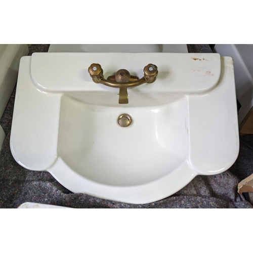 436 - BASIN, 82cm x 54cm, in a scalloped design with taps porcelain on column stand.