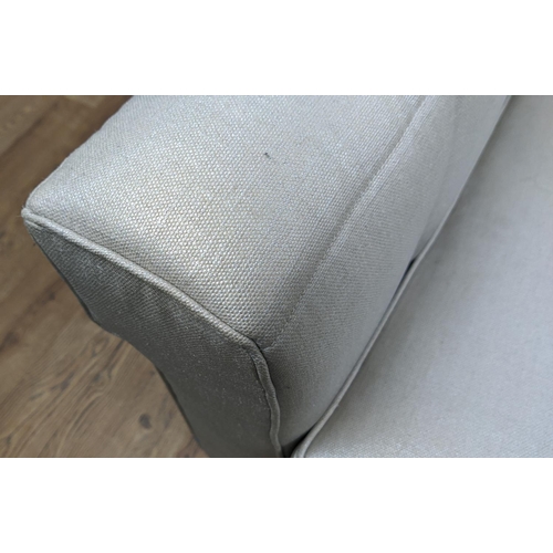 446 - ARMCHAIR, 86cm x 81cm H, in a silvery fabric with matching footstool. (2)