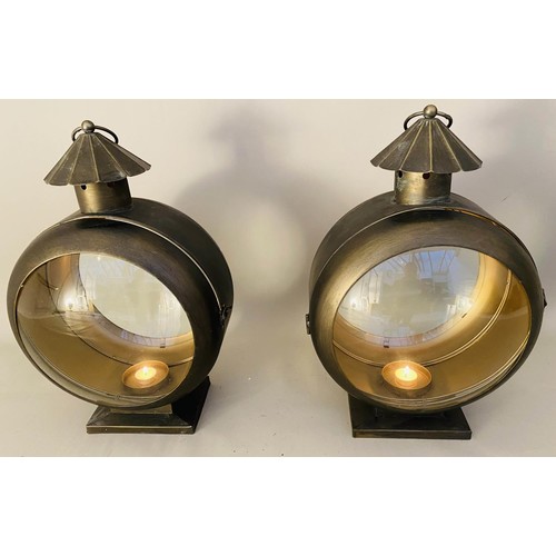 413 - STORM LANTERNS, a pair, convex glass, bronzed metal, 54cm x 37cm x 26cm. (2)