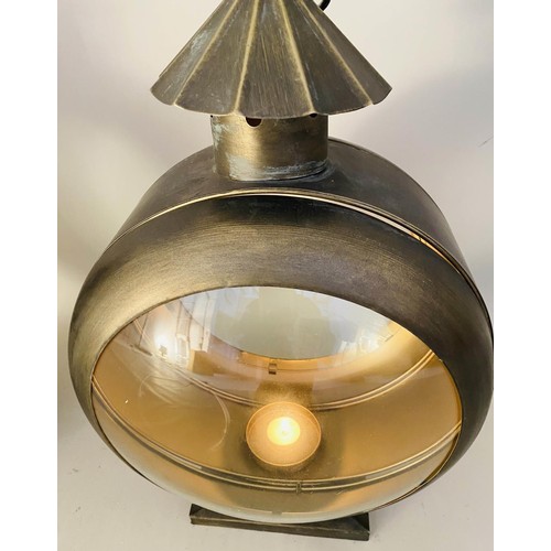 413 - STORM LANTERNS, a pair, convex glass, bronzed metal, 54cm x 37cm x 26cm. (2)